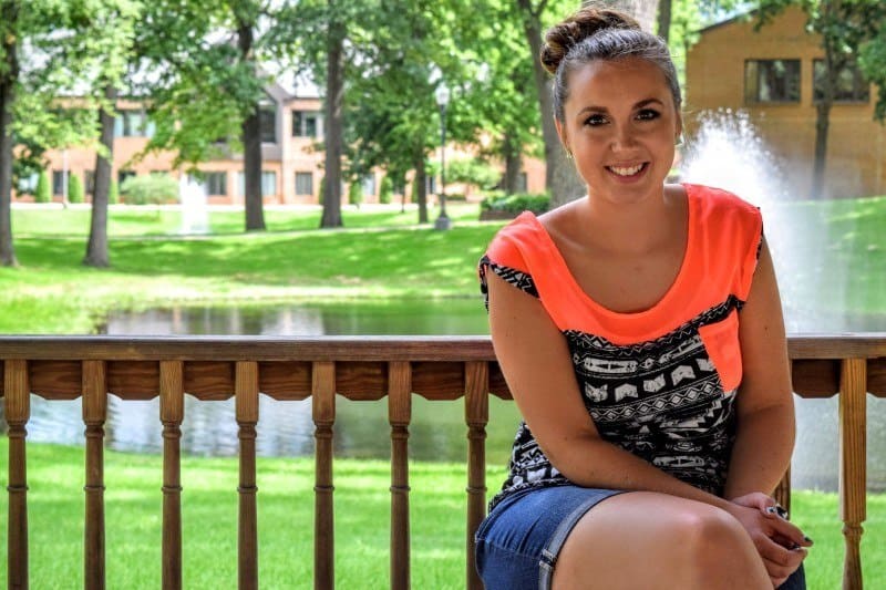 Bethany sitting on a bench
